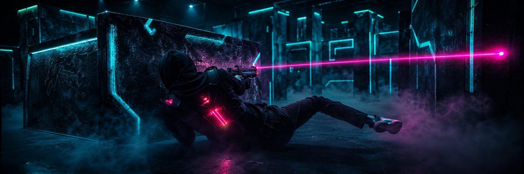 Adult laser tag: a player diving for cover as a laser beam grazes past